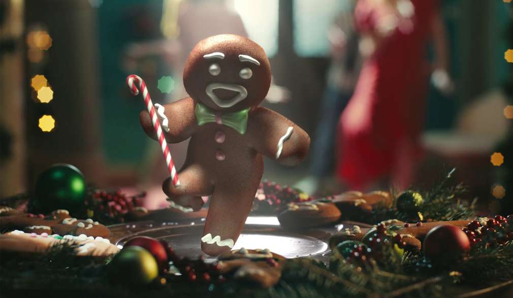 Lebkuchenmännchen mit Zuckerstange tanzt Lebkuchenmännchen mit Zuckerstange tanzt