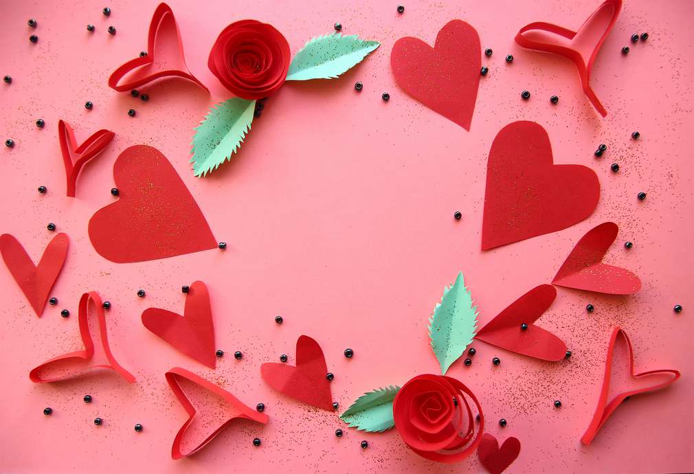 Red hearts on the pink background Red hearts on the pink background