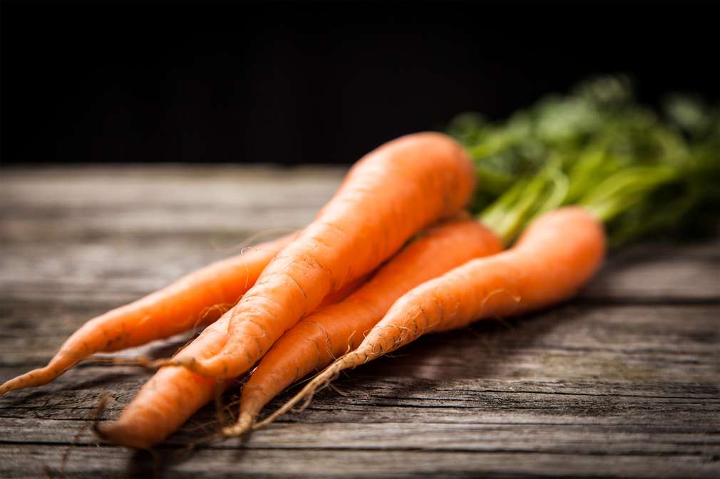 Fresh organic vegetables on wooden surface Fresh organic vegetables on wooden surface